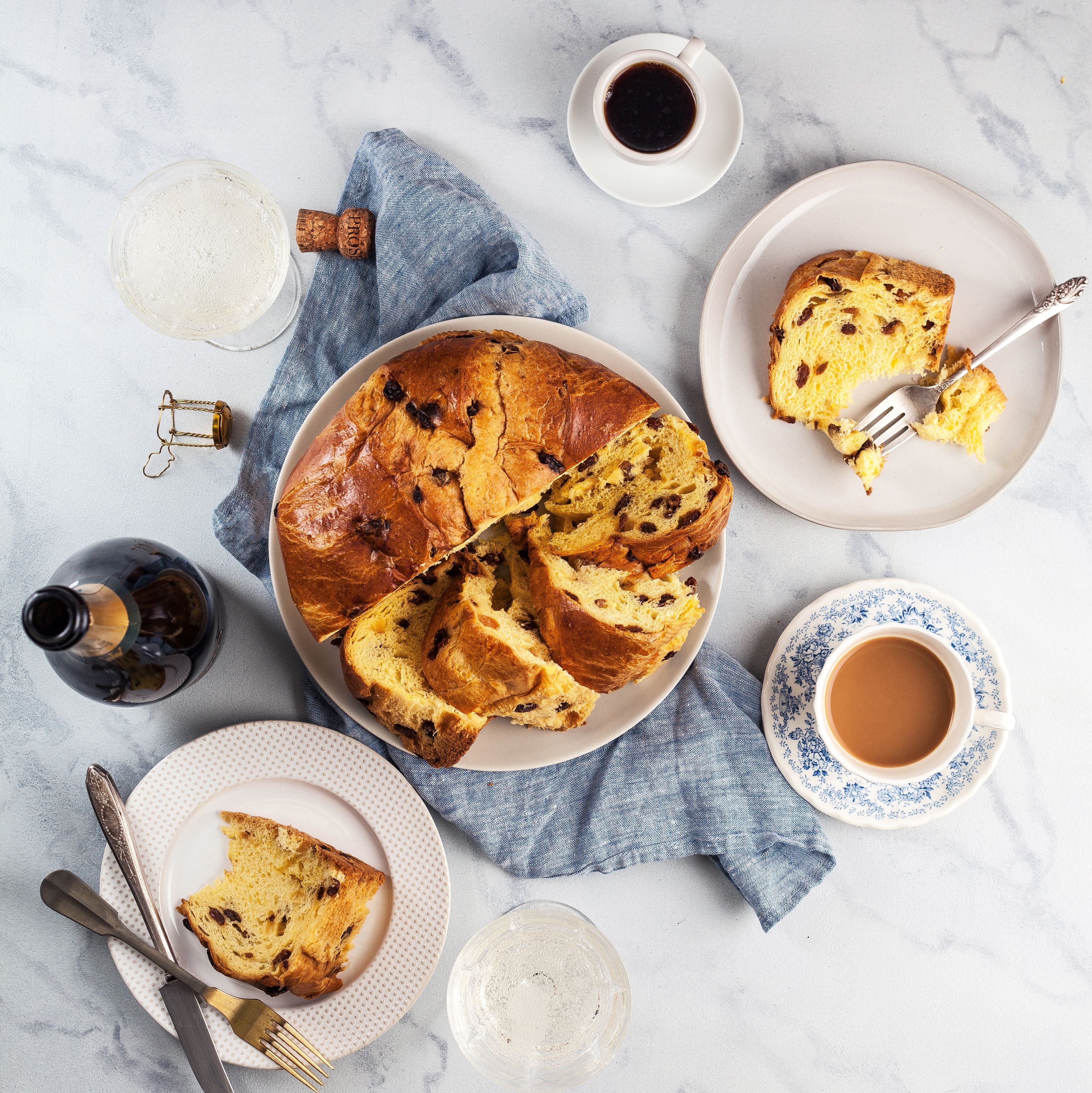 Deliciously sliced sweet bread with chocolate, served on elegant plates and coffee.