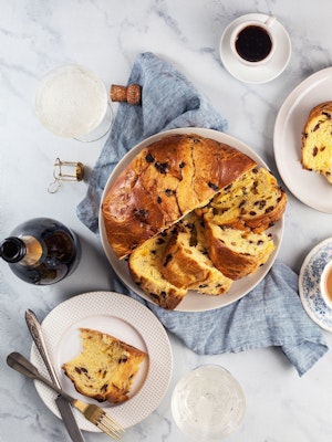 Deliciously sliced sweet bread with chocolate, served on elegant plates and coffee.
