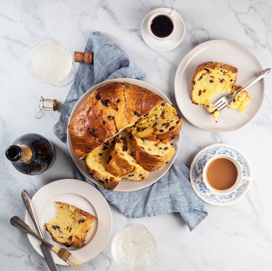 Deliciously sliced sweet bread with chocolate, served on elegant plates and coffee.