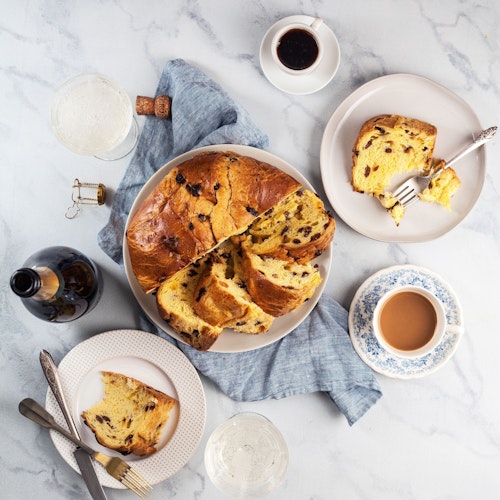 Deliciously sliced sweet bread with chocolate, served on elegant plates and coffee.