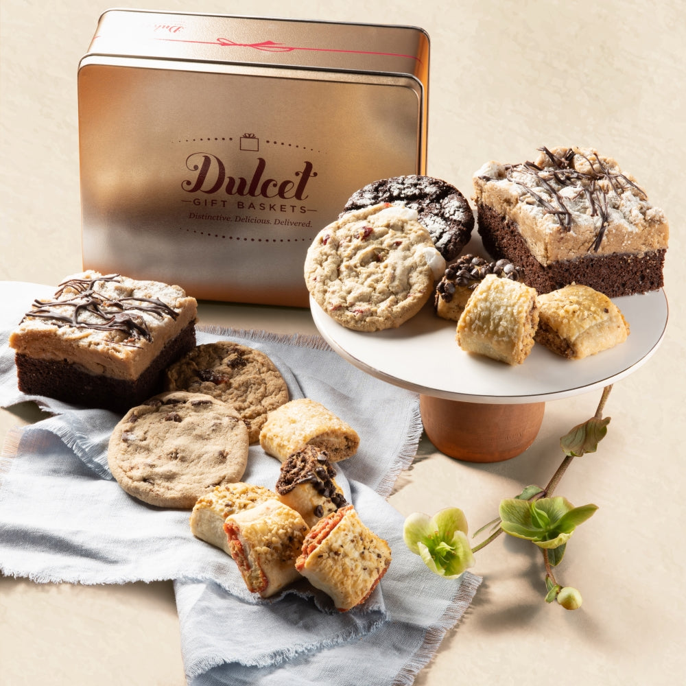 Delicious assortment of cookies and brownies elegantly displayed on a pedestal and tray.