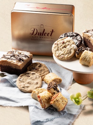 Delicious assortment of cookies and brownies elegantly displayed on a pedestal and tray.