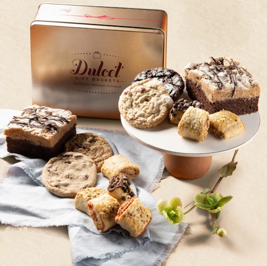 Delicious assortment of cookies and brownies elegantly displayed on a pedestal and tray.