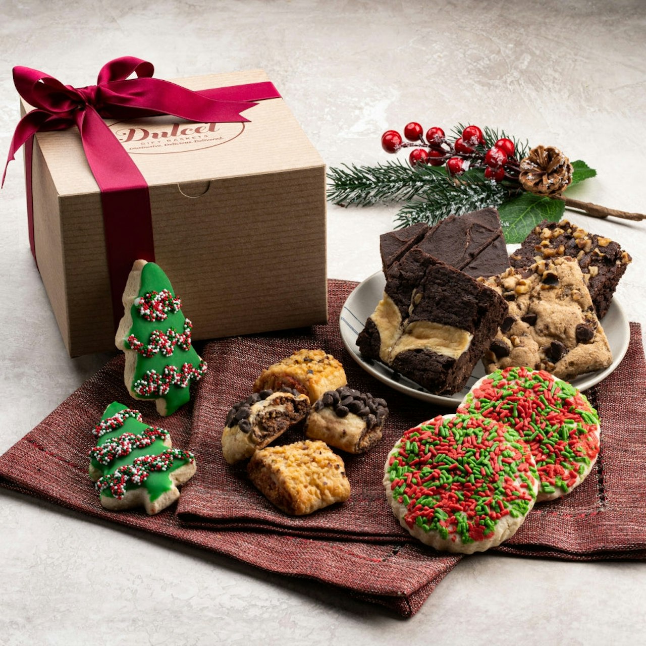 Delicious assortment of festive cookies and brownies in a charming gift box. Perfect for holidays!