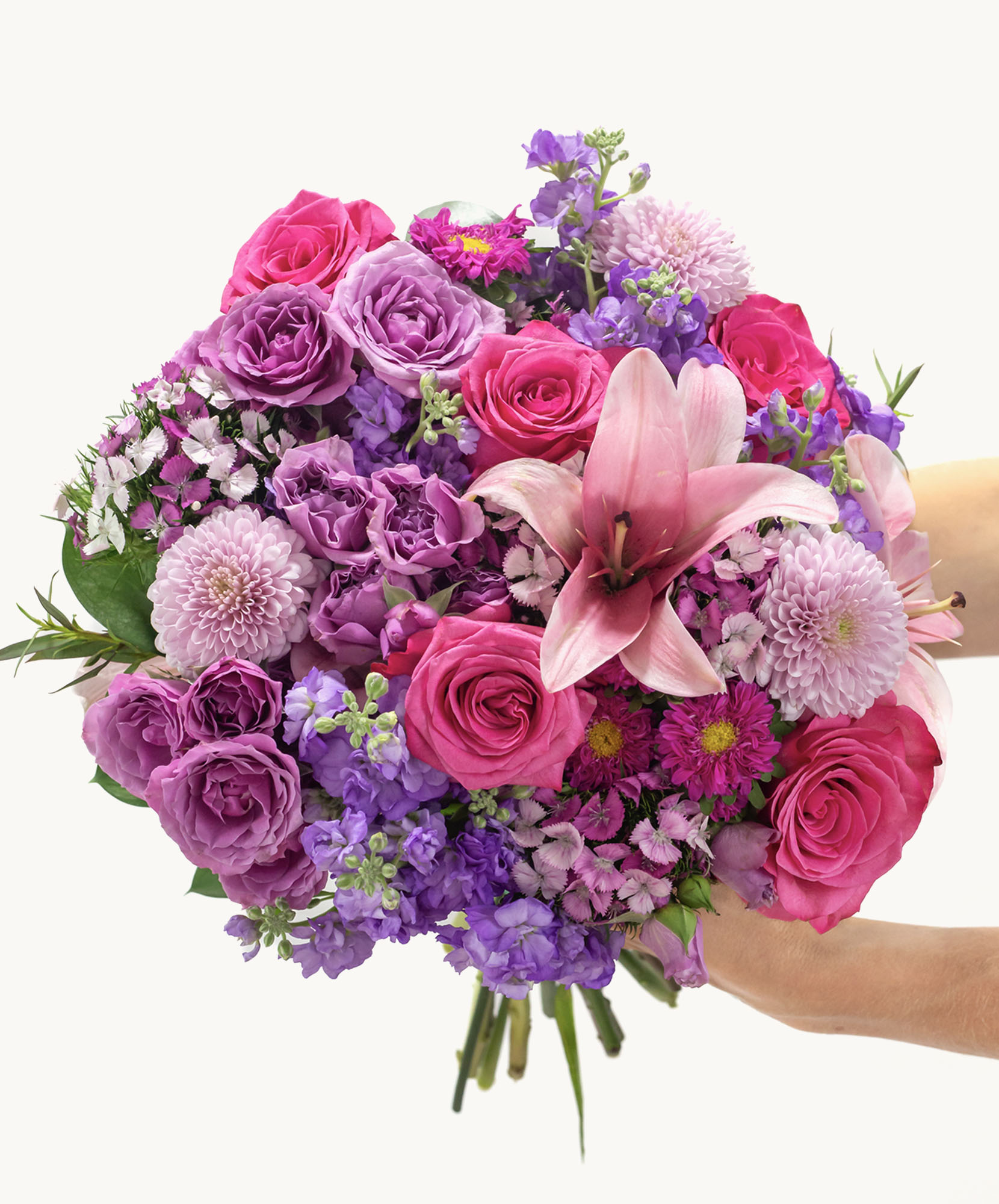 Vibrant bouquet of pink and purple flowers, featuring roses and lilies, ideal for any occasion.