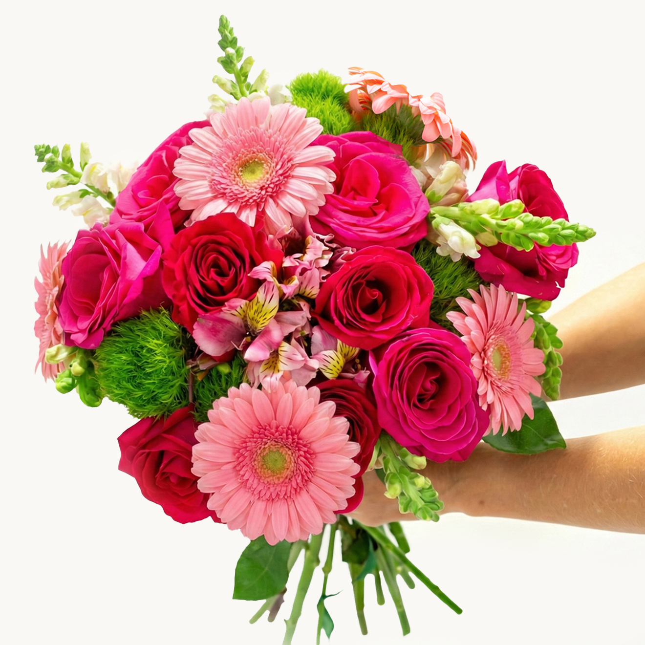 Vibrant bouquet featuring pink roses, gerbera daisies, and colorful florals in hand.