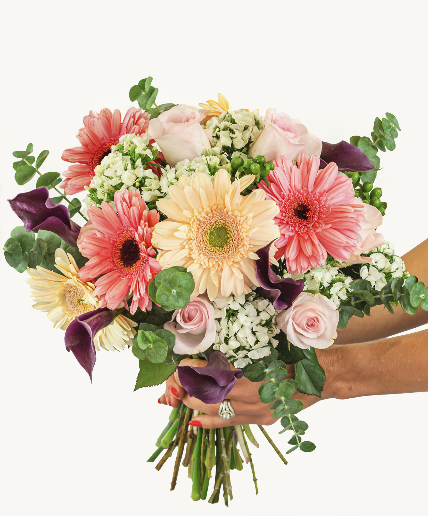Vibrant bouquet featuring pink and peach gerbera daisies, elegant roses, and greenery.