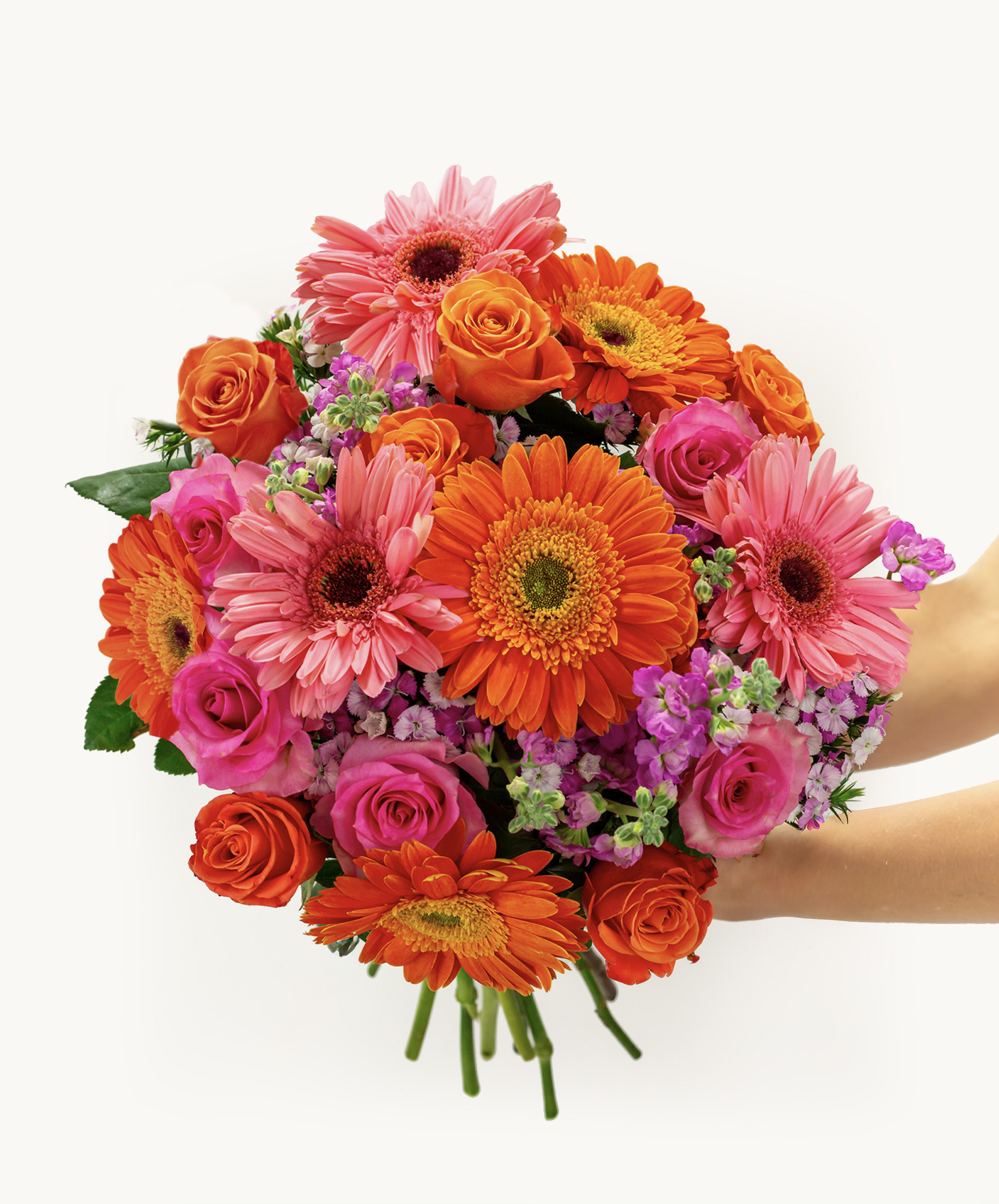 Vibrant bouquet featuring pink and orange gerbera daisies and roses, perfect for celebrations.