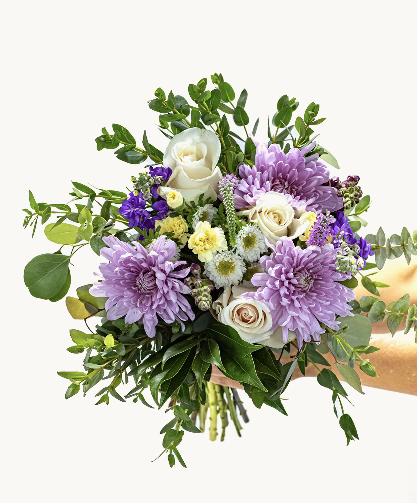 Vibrant bouquet featuring lavender chrysanthemums, roses, and lush greenery.