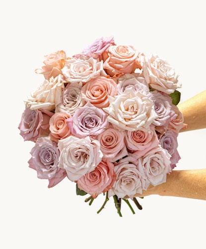 A stunning bouquet of pastel roses in soft pink and lavender hues, perfect for gifting.