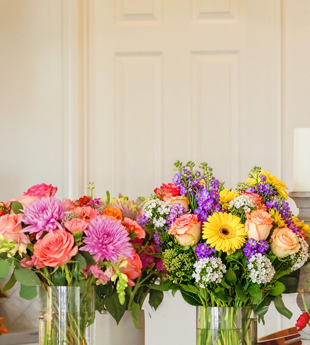 Vibrant floral arrangements featuring pink roses, yellow gerbera daisies, and more.