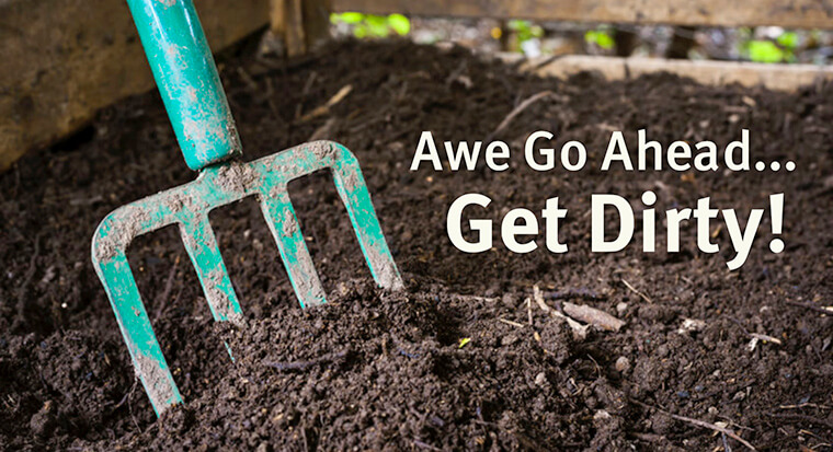 A photo of soil with a pitch fork and the text "Awe Go Ahead... Get Dirty!" in white on the soil