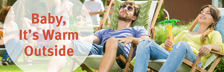 Baby, it's warm outside - a couple sitting outside on chairs in the sun