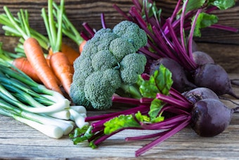 a variety of winter vegetables on a wooden table