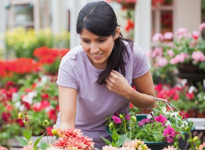 Woman shopping for plants in a garden center