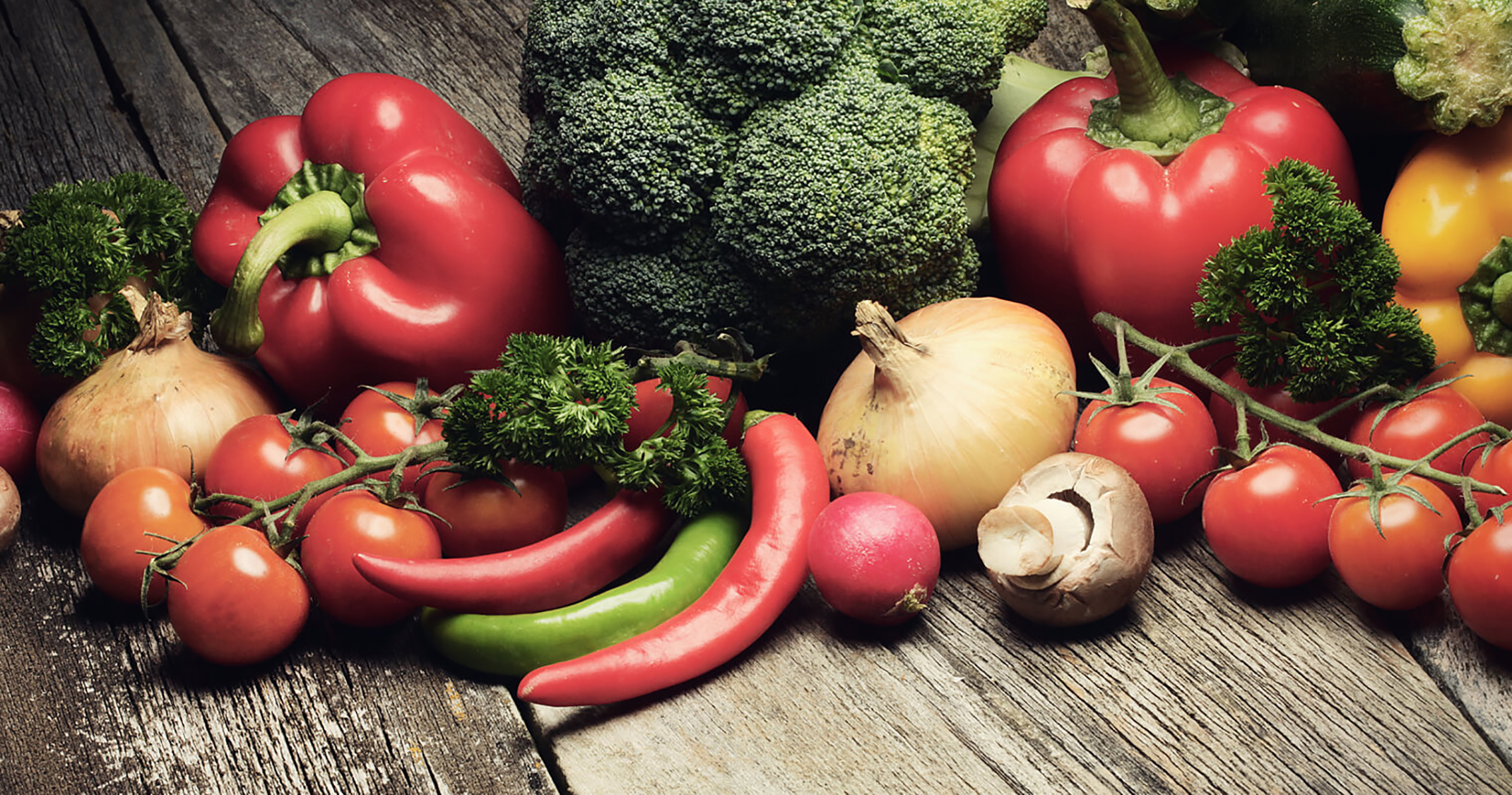 Fresh mixed vegetables on wooden table