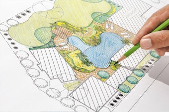 A drawing that maps out the footprint of a home and its landscape