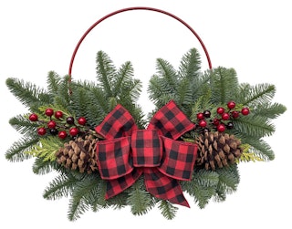 Holiday decor - golden forest wreath powder coated ring which is beautifully decorated with noble fir, western red cedar, faux berries all capped with a large festive bow