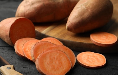 Sliced and whole sweet potatoes grown from edible bulbs