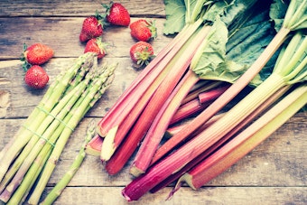 Asparagus, Strawberries and Rhubarb on a wooden table