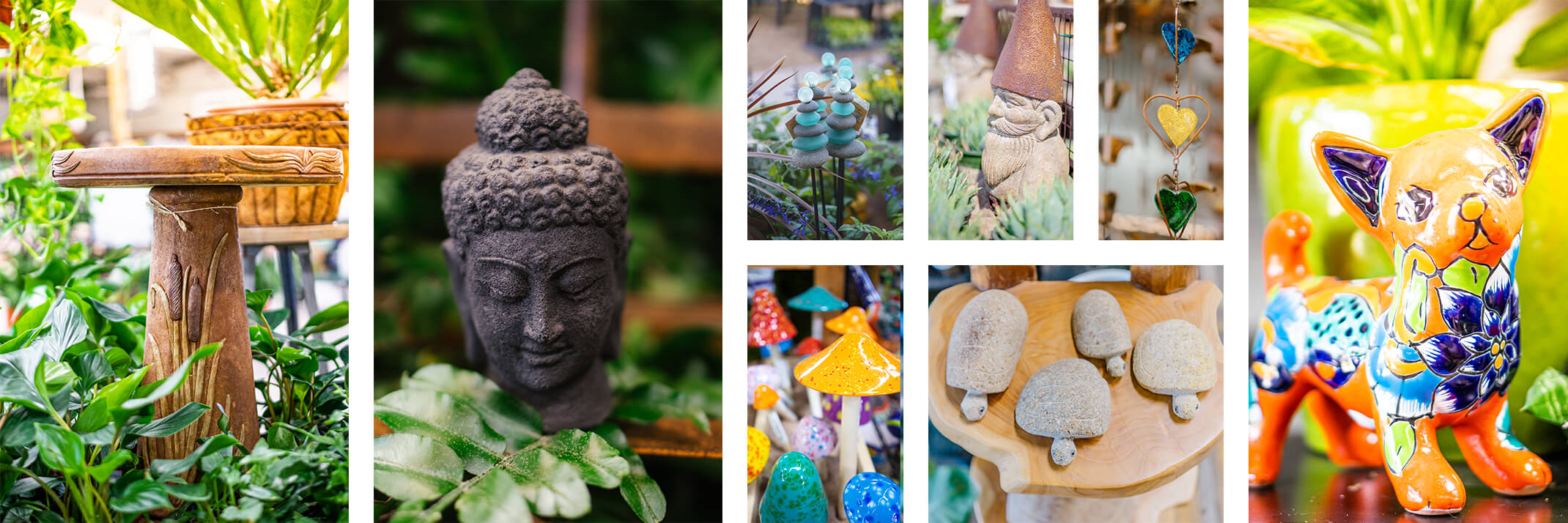 A stone birdbath with reeds, a Buddha head, glass and rock stakes, ceramic Shroomyz, stone turtles, a garden gnome, a metal hearts rainchain, and a Talavera kitty.