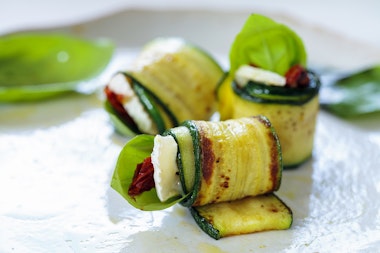 Grilled zucchini rolls with cheese, basil and sun dried tomatoes.
