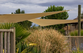 Shade triangles in garden landscape.