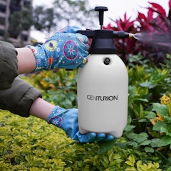 woman spraying garden with centurion sprayer