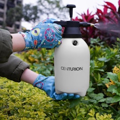 woman spraying garden with centurion sprayer