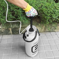 woman using centurion 2 gallon garden sprayer