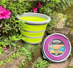 centurion collapsible pink and yellowish green garden bucket on steps in garden
