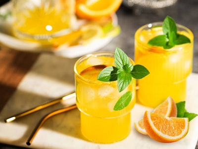orange ginger fizz mocktail drink made with fresh citrus