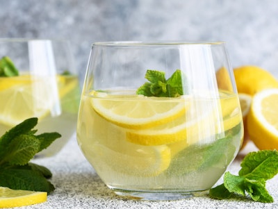 classic lemonade sparkler mocktail with citrus lemon garnished with mint