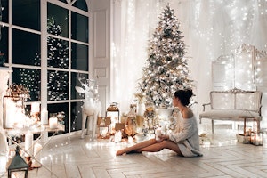 woman surrounded by white christmas decor summerwinds arizona
