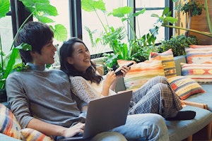 happy couple in living room with houseplants summerwinds arizona