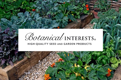 A vegetable garden with the Botanical Interests logo centered on it.