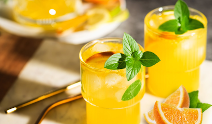 orange ginger fizz mocktail drink made with fresh citrus