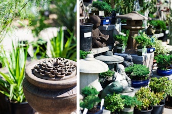 A fountain, and a variety of Asian-inspired statues, Bonsai trees and other plants.