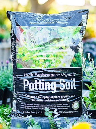 SummerWinds Nursery High Performance Organic Potting Soil surrounded by plants at SummerWinds.
