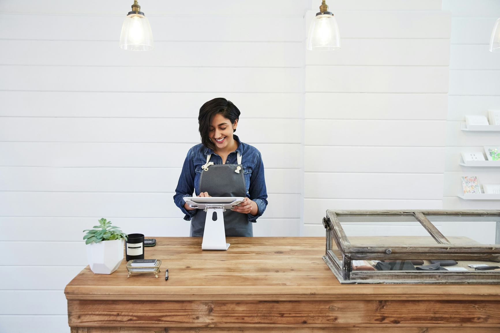Woman standing at the cashier desk