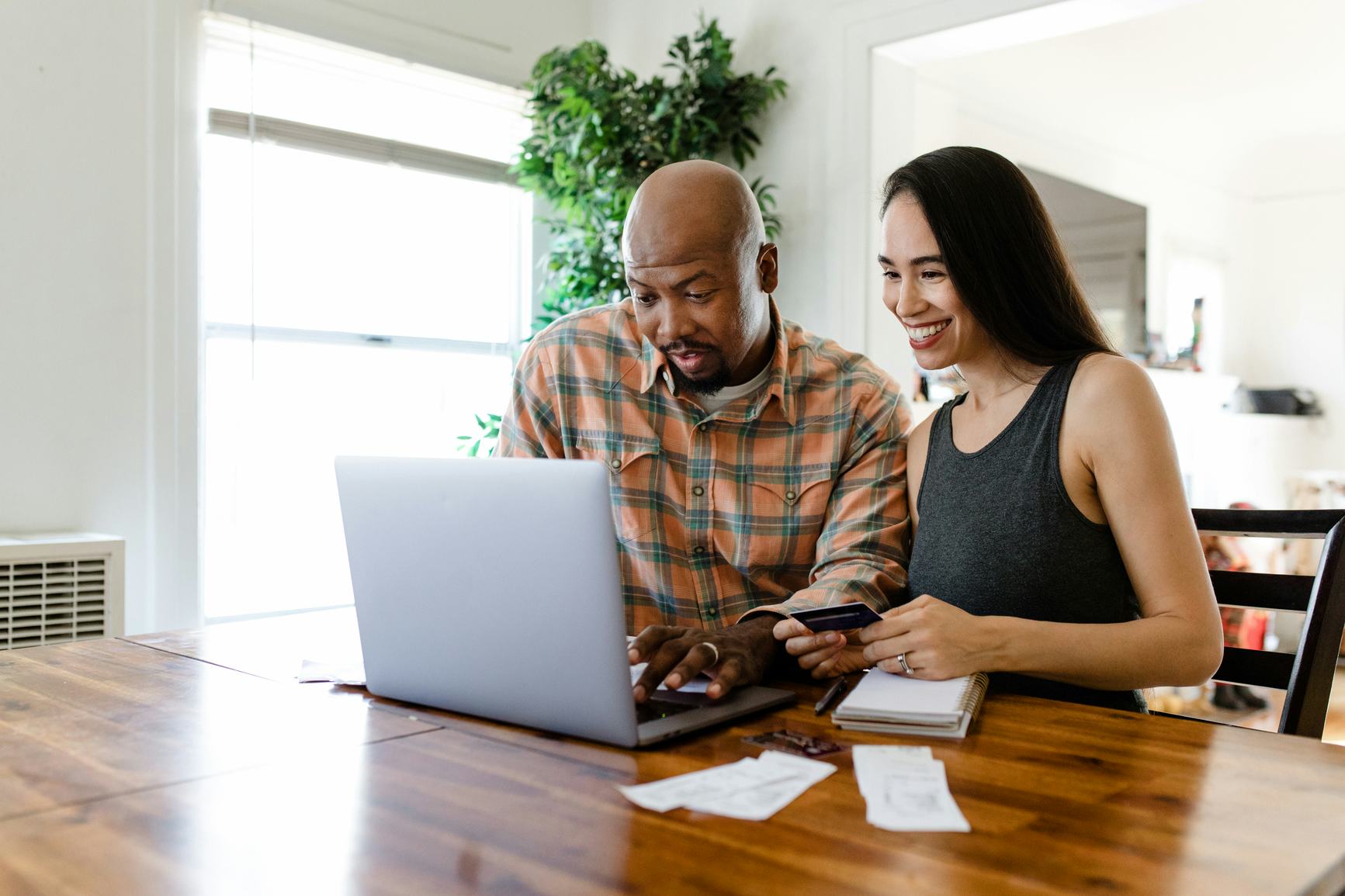 Man and woman typing on a computer