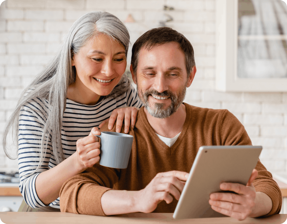 Couple looking at a tablet