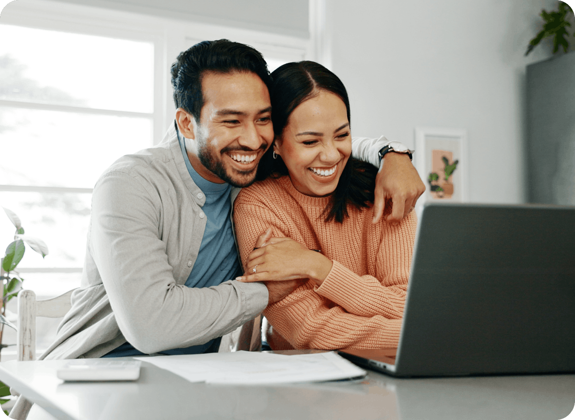 Couple looking at a laptop