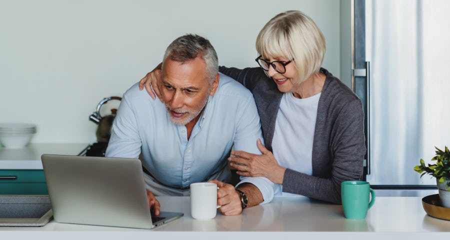 Couple looking at a laptop