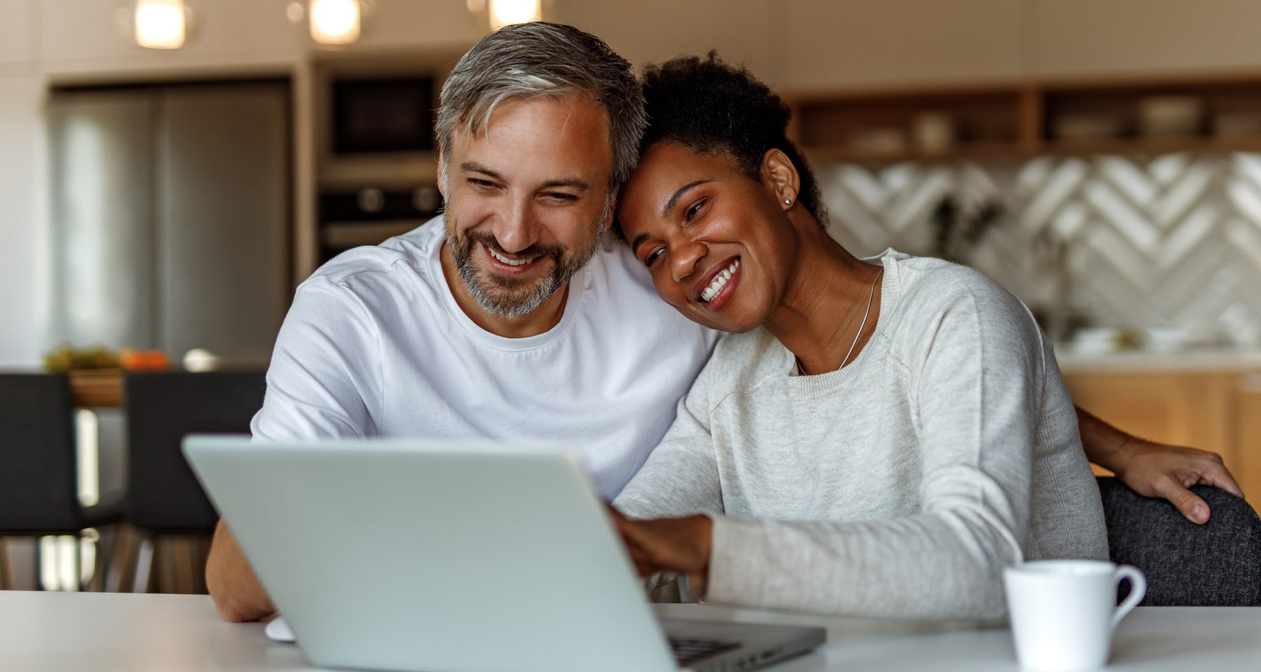 Couple looking at a laptop