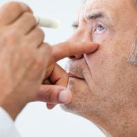 Man receiving a check up for his eyes.