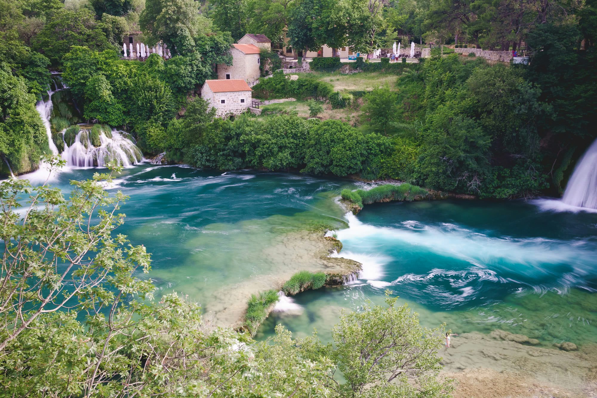 Looking down over the falls with turquoise water