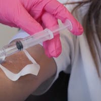 Exosome syringe going into arm