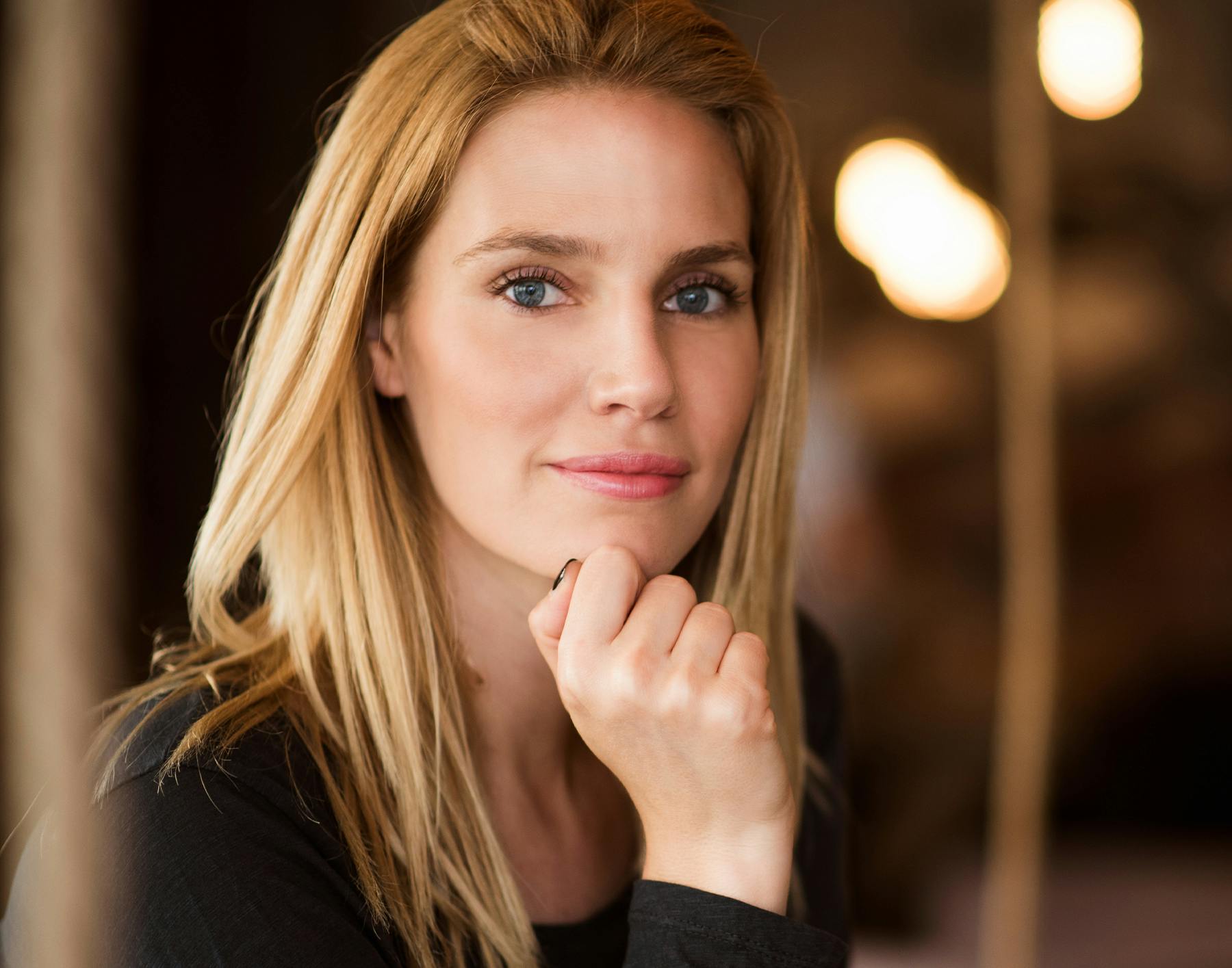 blond woman with blue eyes and long blond hair posing for a picture