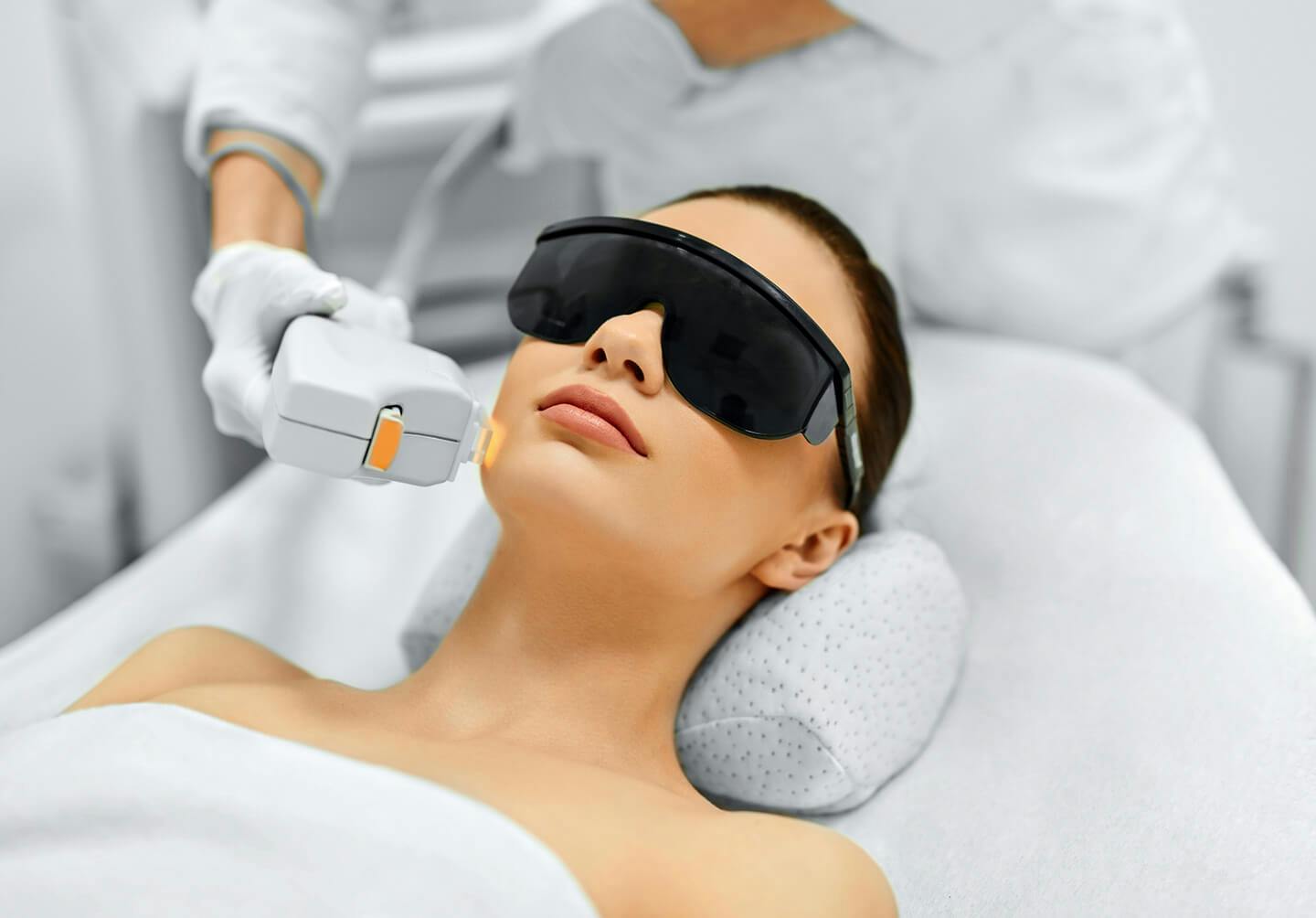 woman getting a laser treatment in a beauty salon